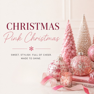 Pink Christmas themed graphic with the text 'CHRISTMAS Pink Christmas' and a decorative arrangement of pink and white ornaments, two textured Christmas trees, a pink candle in a glass holder, and pink ribbon on a light cream background.