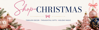 A festive holiday banner with the words 'Shop CHRISTMAS' in pink and navy lettering, with decorative ornaments, pine branches, ribbons, and a pink background.